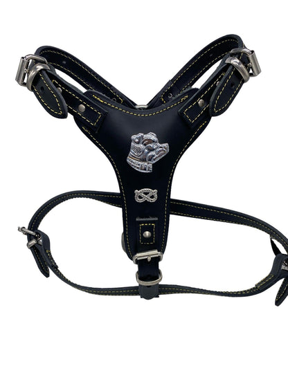 A black leather Harness made for staffies with a Stafforshire knot and Staffy emblem on the dogs breastplate with adjustment holes to fit most sizes of Staffies.