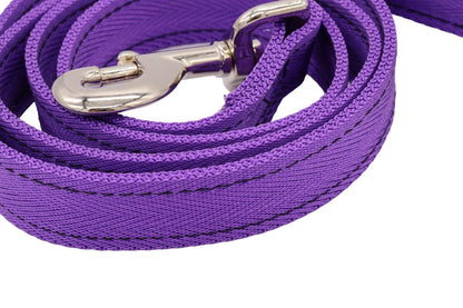 A close up of the herringbone double thickness nylon lead in purple with a trigger hook.