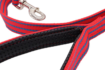 A red nylon double thickness webbing lead with a padded handle. The pattern is three strips of blue and green overlapping diamond shapes. A close up view of the handle and pattern.