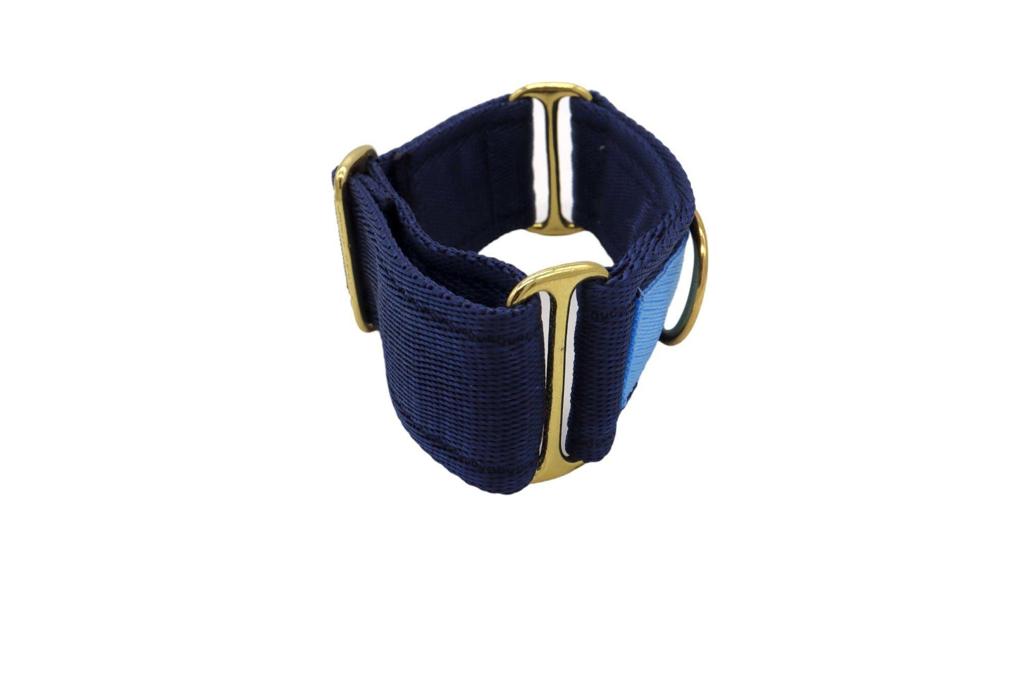 A side view of the navy and light blue martingale style collar. Three sliding buckles fo tightening and a ring to connect to the lead.