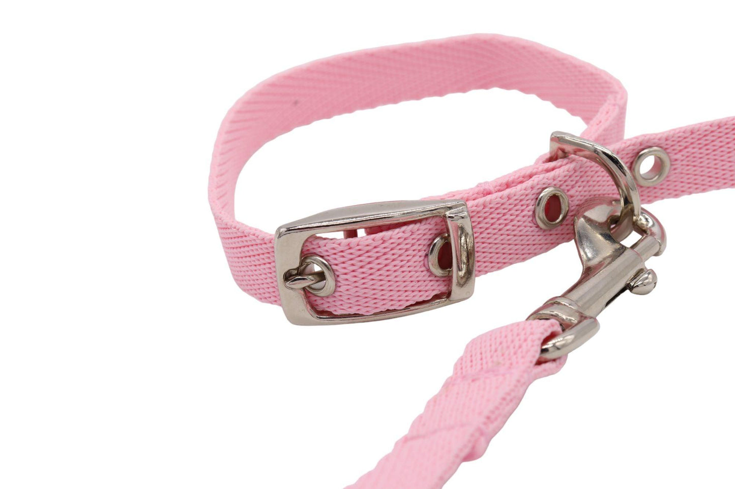 A pink puppy collar and lead matching set. Showing the detail of the bright buckle and trigger hook set.