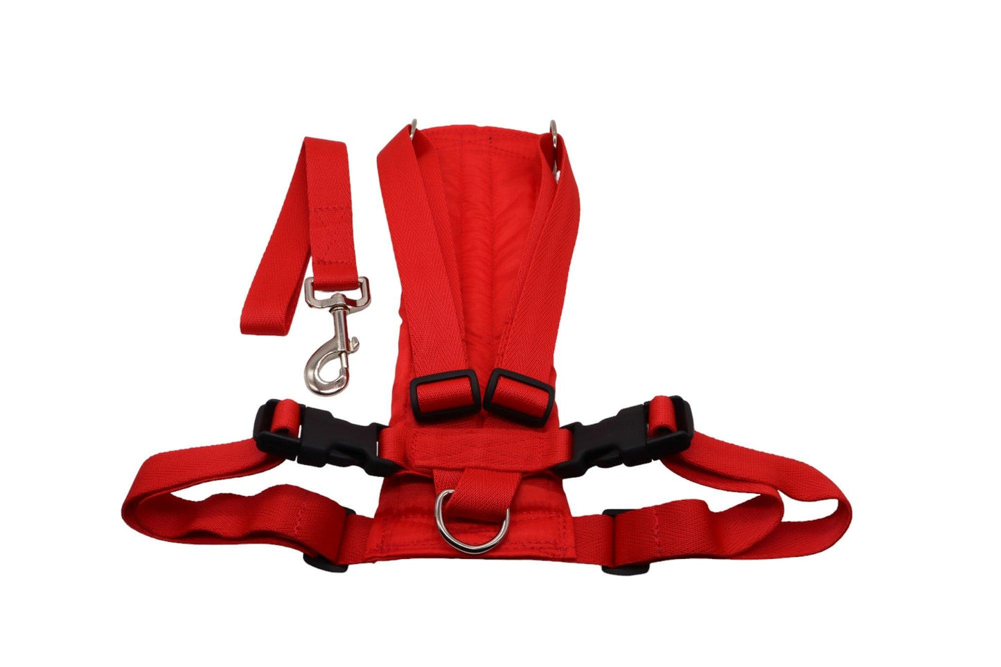 Red size F car safety harness with a handle laid to the side of it.